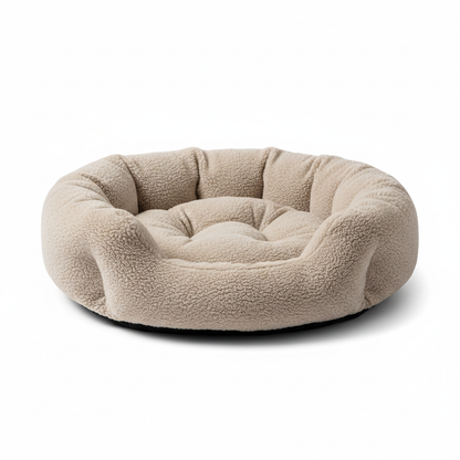 Round sherpa donut pet bed in sand beige, angled view